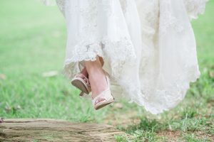 bride in lace wedding dress and shoes