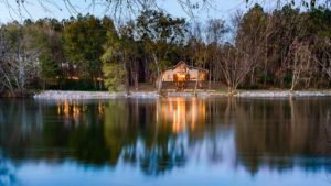 hiwassee river weddings venue reflecting in the water at night