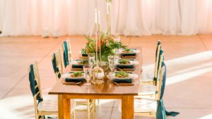 gold chairs from Luma design with green sashes